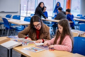 adult and child using a learning circuit board