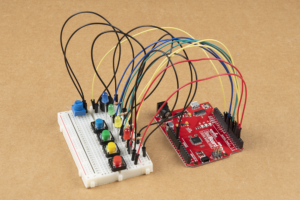 Breadboard with colored buttons and LEDs connected to an Arduino