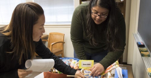 Faculty and students take inventory at the Snack Shack, a small food pantry on campus at Boise State University. 