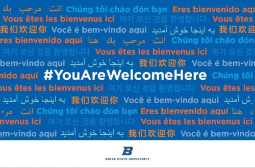 Poster that reads #YouAreWelcomeHere in multiple languages. 