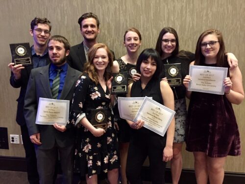 Journalism students pose with their awards