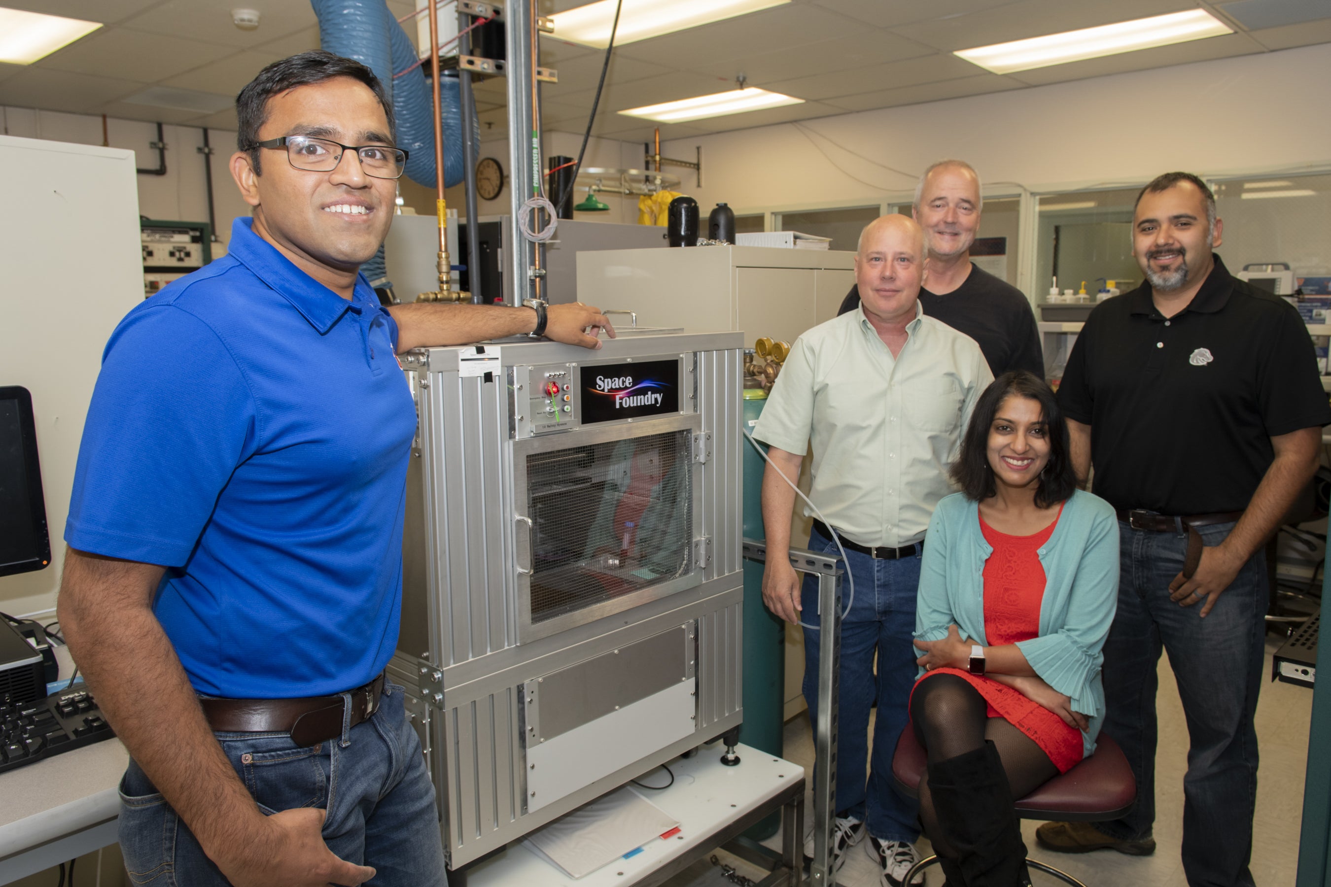 Photo of plasma jet team in lab by plasma jet printer