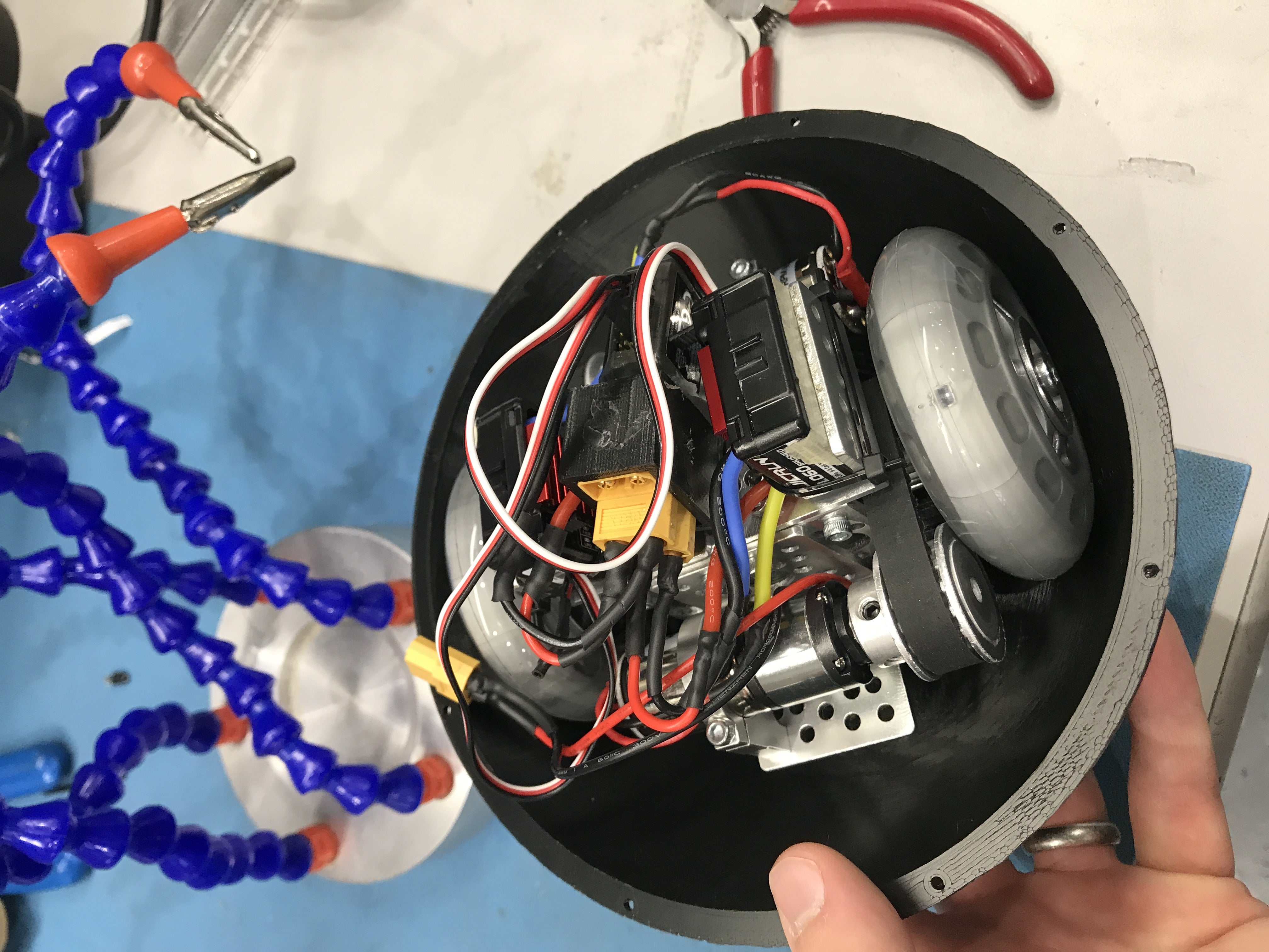 Hnds holds shell of spherical robot, filled with electronics
