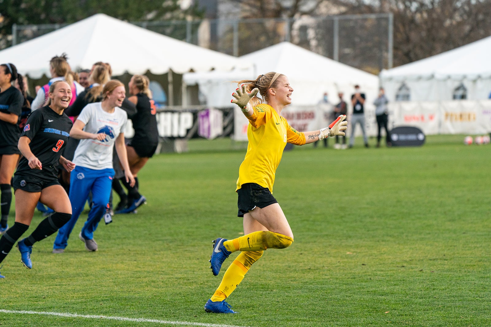 soccer players celebrate on field