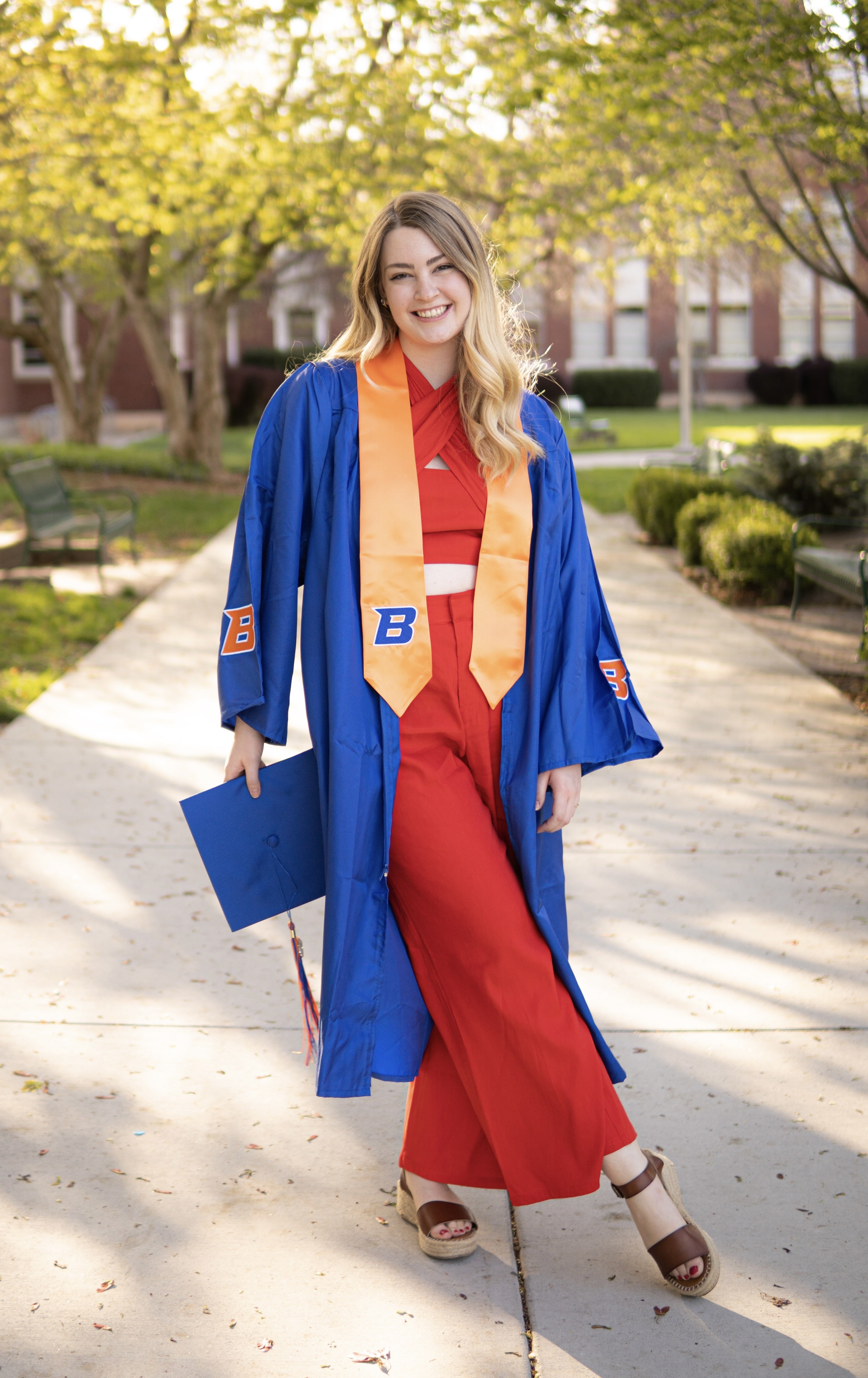 Grace Hall poses in her cap and gown
