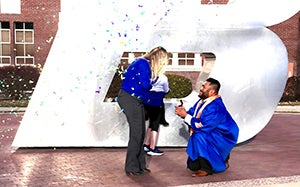 Jorge proposing in front of the B on campus