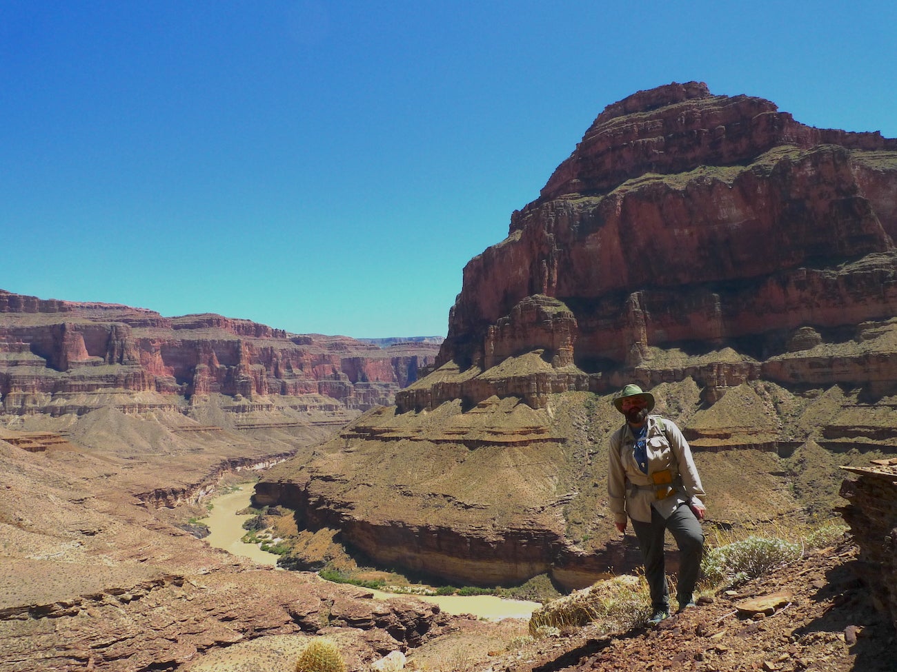 Morh stands with enormous Grand Canyon geologic formation behind him