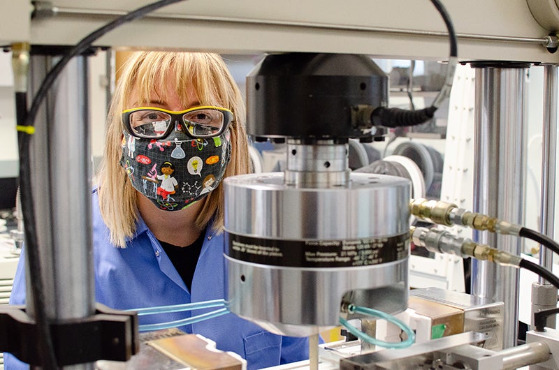 Kaelee Novich appears in lab behind equipment