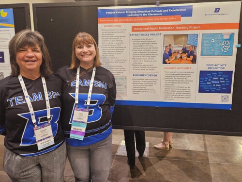 Tammie Sherner and Tracee Chapman stand by their poster entitled "Behavioral Health Medication Teaching Project".