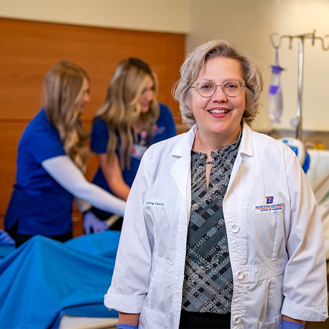 A nurse poses for a photo