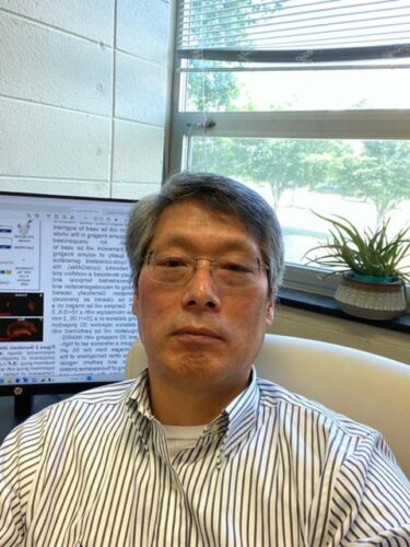 Boise State neuroscience program director Hwan Kim sitting in his office.