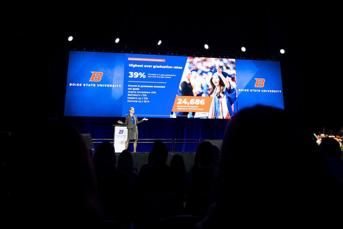 President Marlene Tromp presents in auditorium