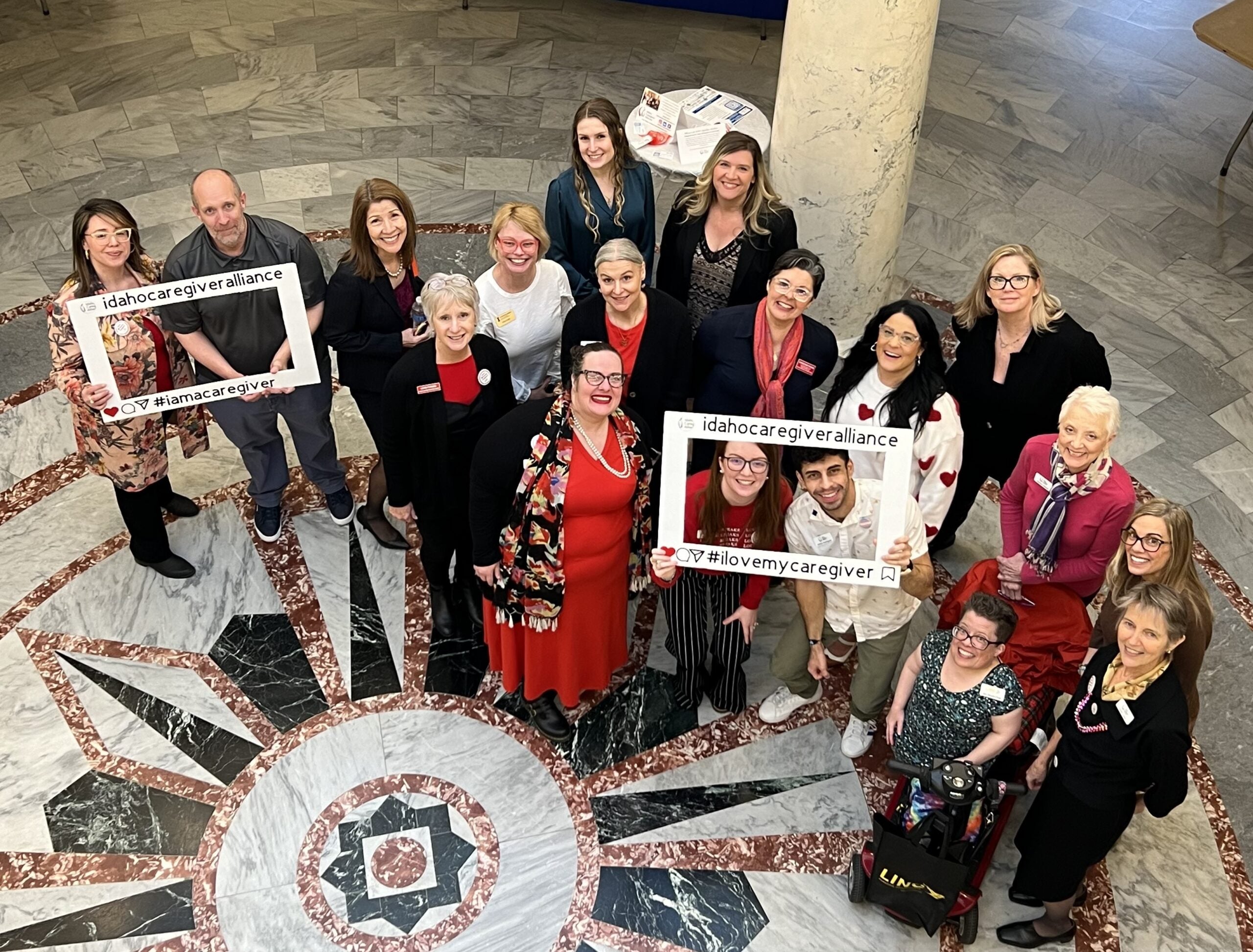 Persons pose in the Idaho State Capitol Rotunda