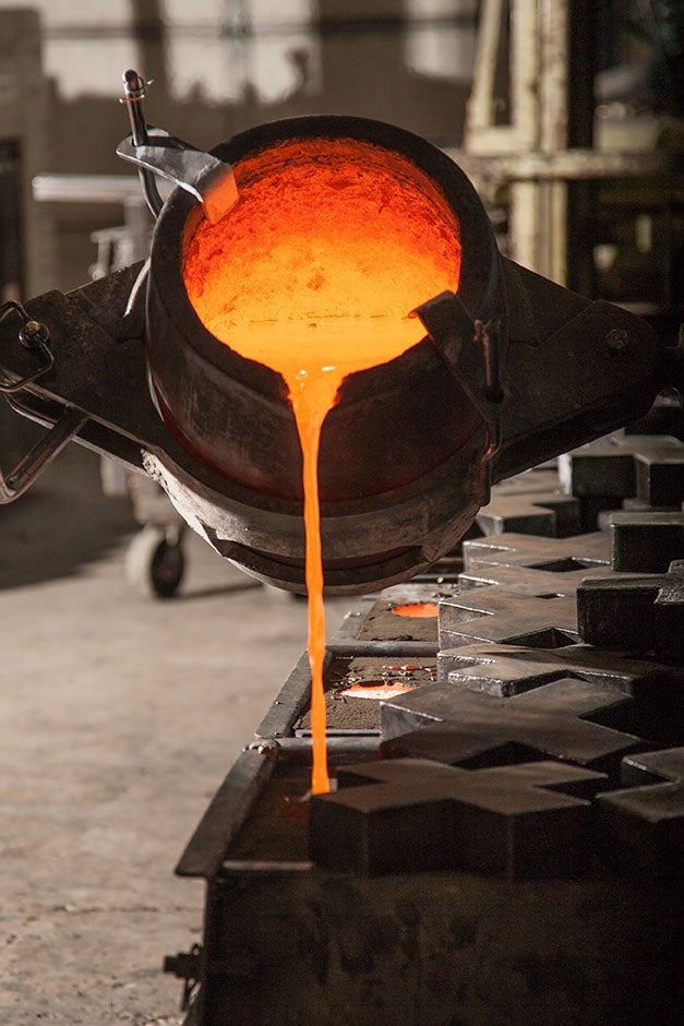 Molten bronze being poured into molds at Sun Valley Bronze