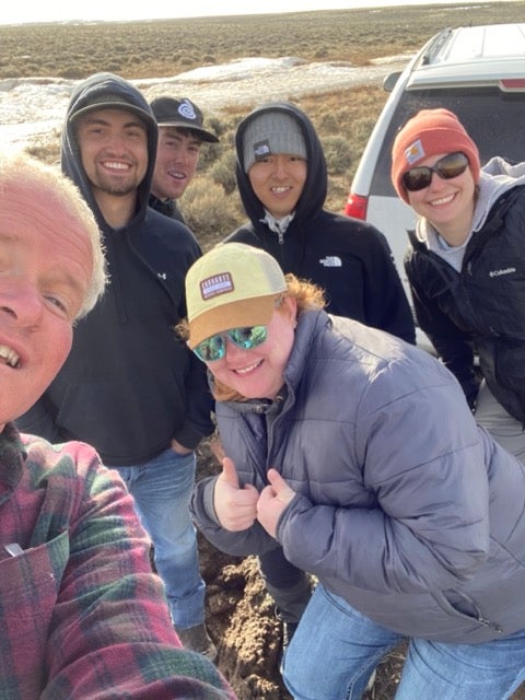 Students pose for a selfie with their instructor