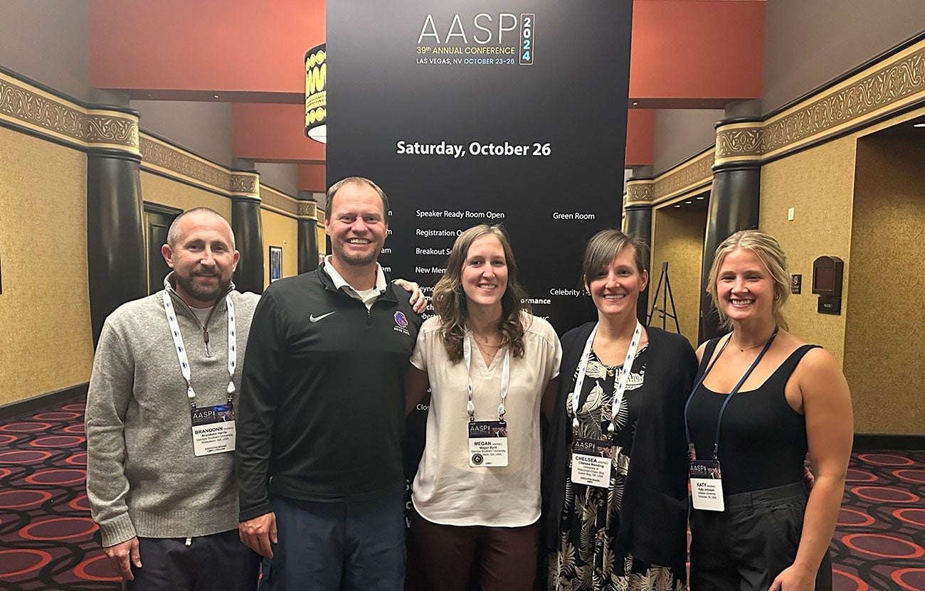 Eric Martin and his award-winning team pose at the conference