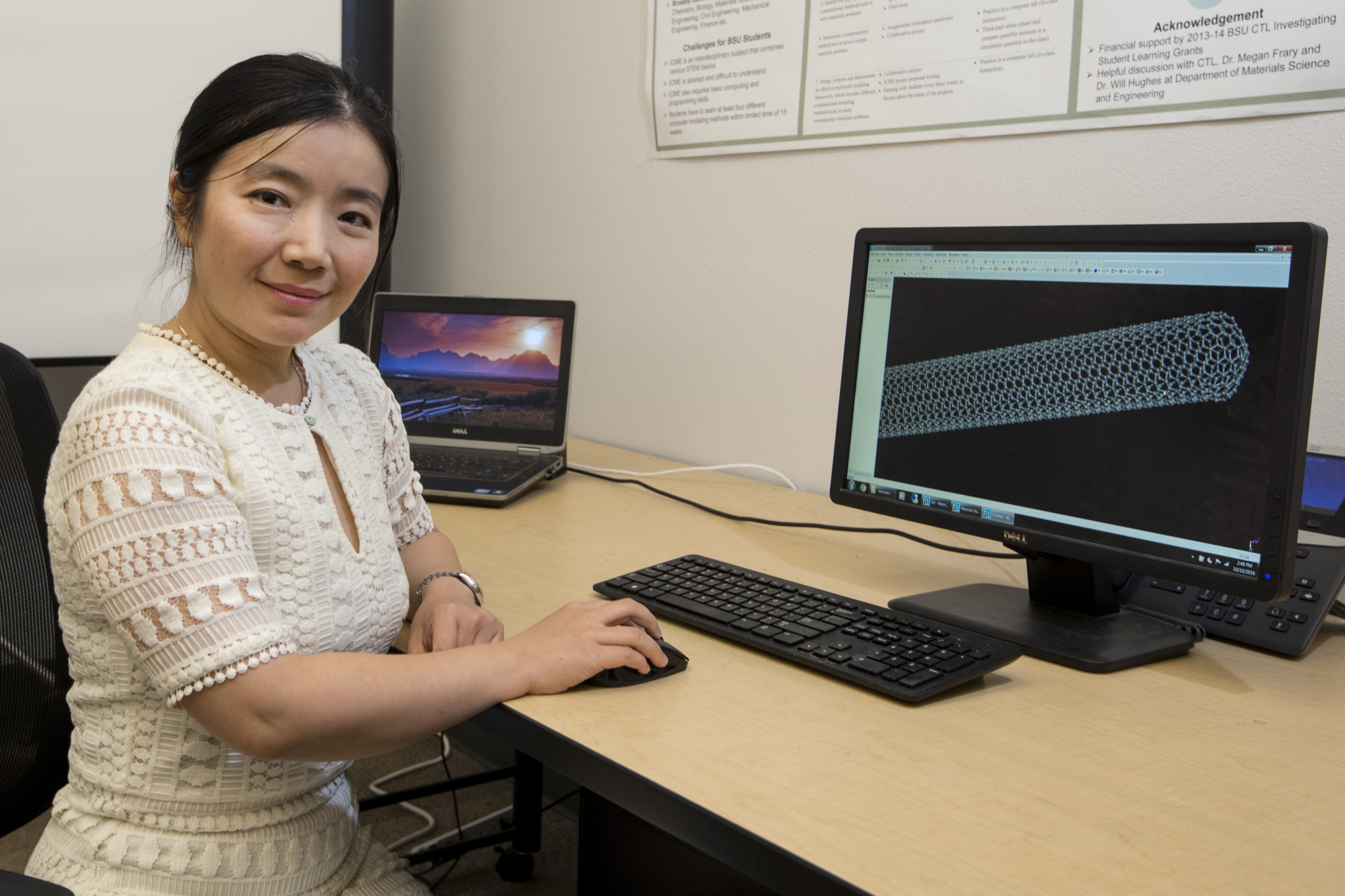 Professor Lan Li pictured with computer. 
