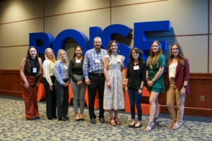 Nagel scholars standing in front of a Boise State sign