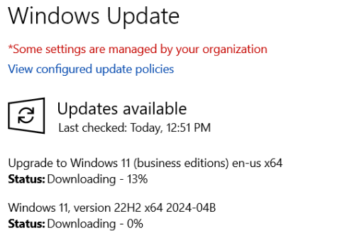 Windows Update screen showing Windows 11 available for download.