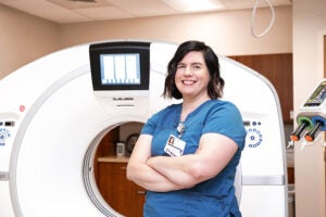 Ana Screiber in front of medical imaging equipment