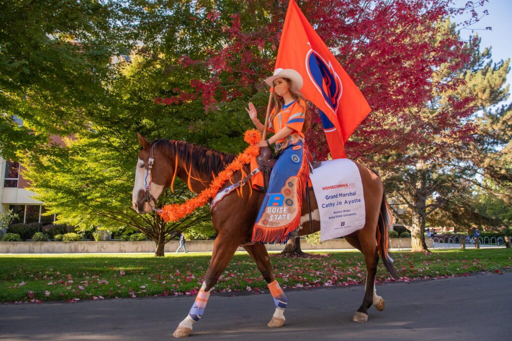 Public health graduate Cathy Jo Ayotte serving as Grand Marshal in the 2021 Boise State Homecoming Parade