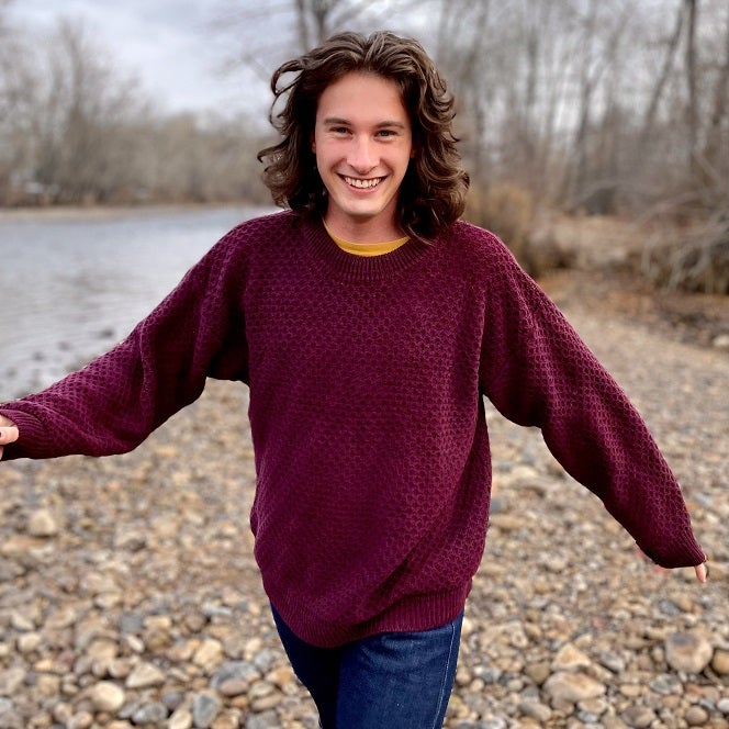 Dustin is photographed next to the Boise river
