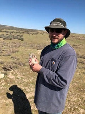 Brent Clark with small male Burrowing Owl