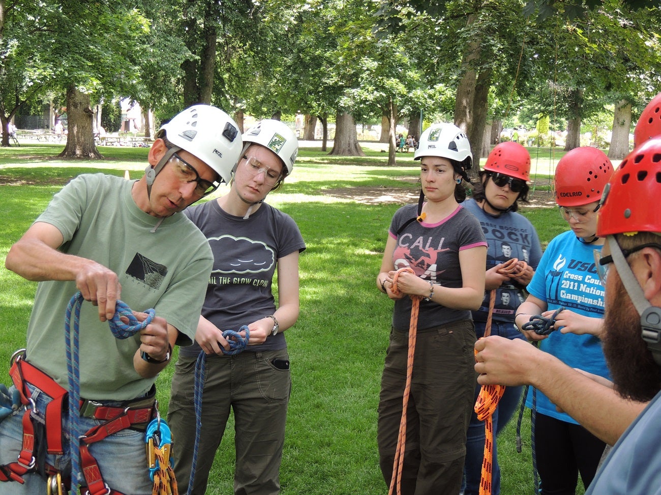 REU students learning climbing techniques in order to access raptor nests