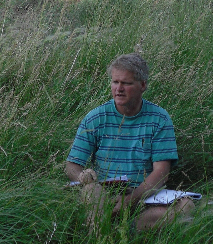 Raptor Biology Student Eric Atkinson recording data in the field