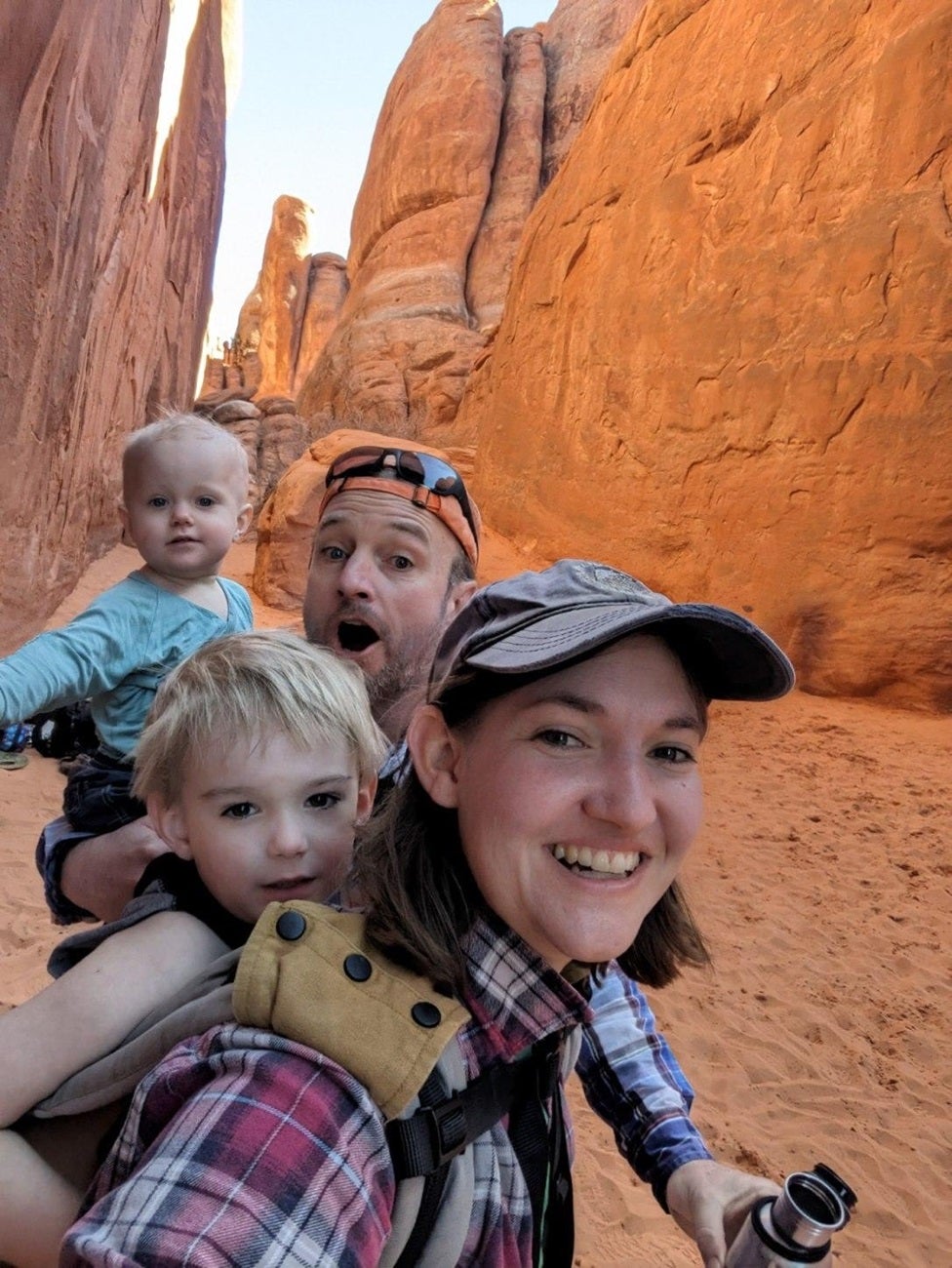 Jay Carlisle with his wife, Heidi, and two children on a hike