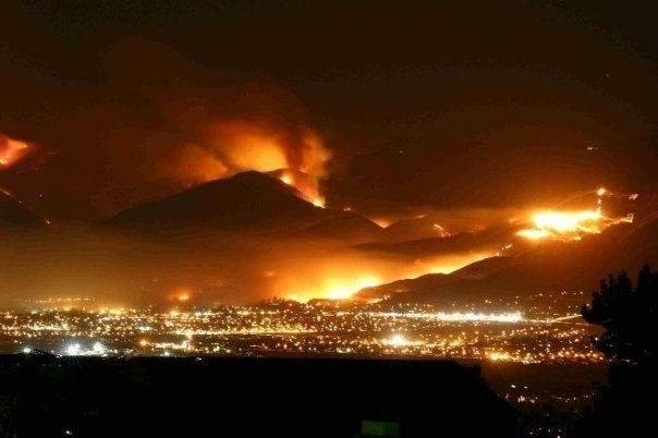 Foothills on fire above the city of Boise at night