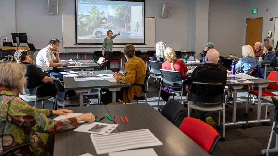 Brittany Brand, a professor at Boise State University and Director for the Boise State Hazard and Climate Resilience Institute leads a workshop, with about 25 ashland residents, on how to make their homes more fire resistant. Ashland.news photo by Bob Palermini