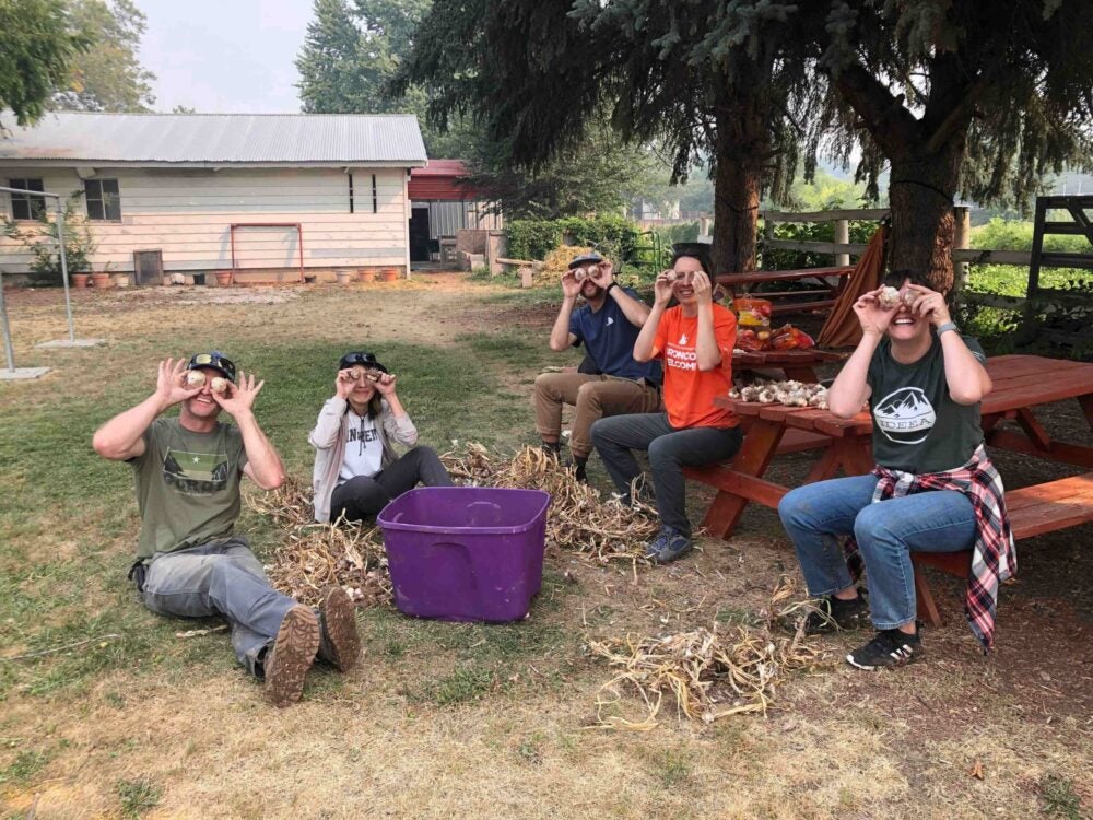 students holding garlic