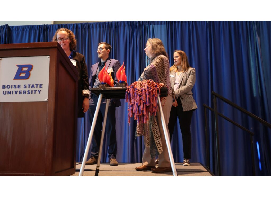 A photo of Michal Temkin Martinez announcing the fund and presenting it to Donna Llewellyn