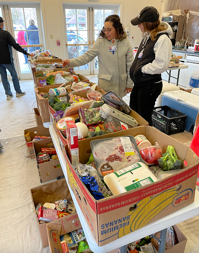 Volunteers sorting through food donations