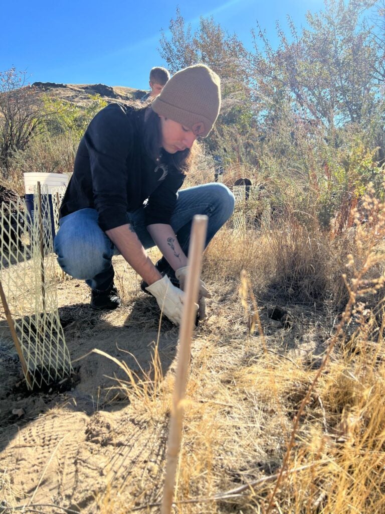 Student digs in the dirt. 