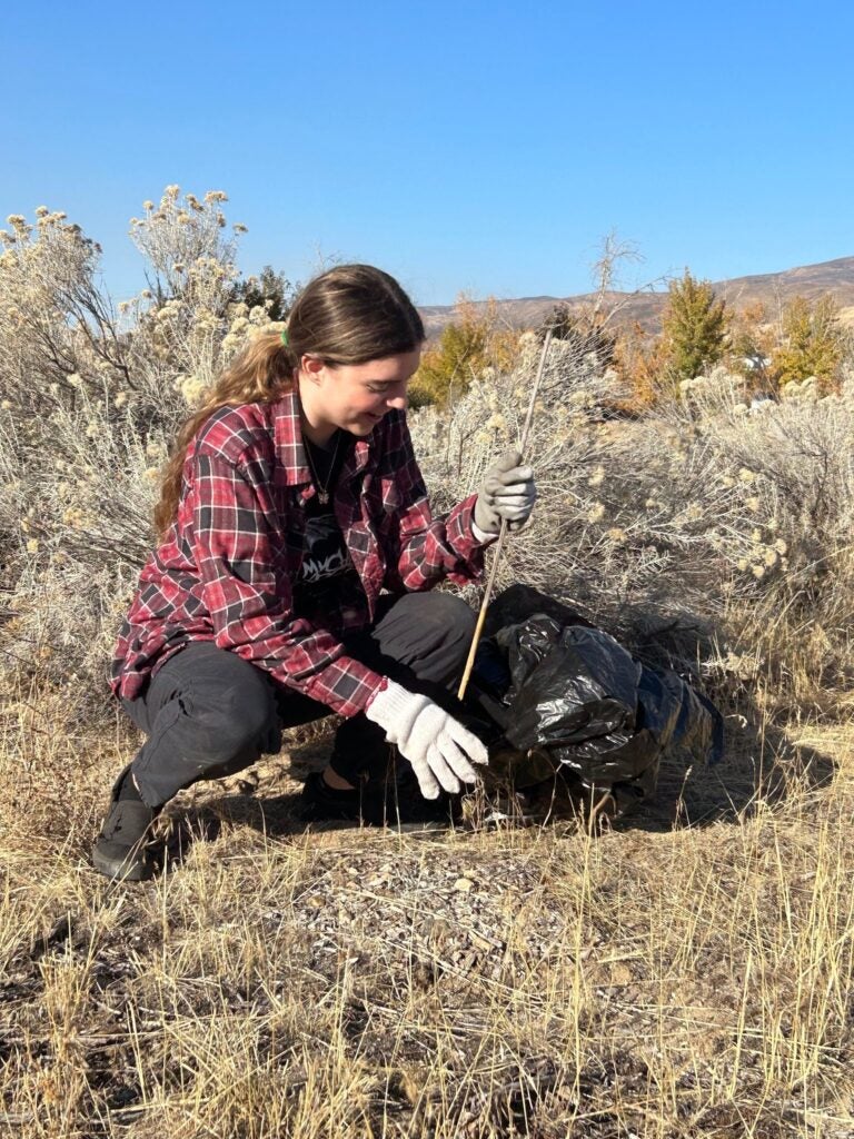 Student digs in the dirt. 