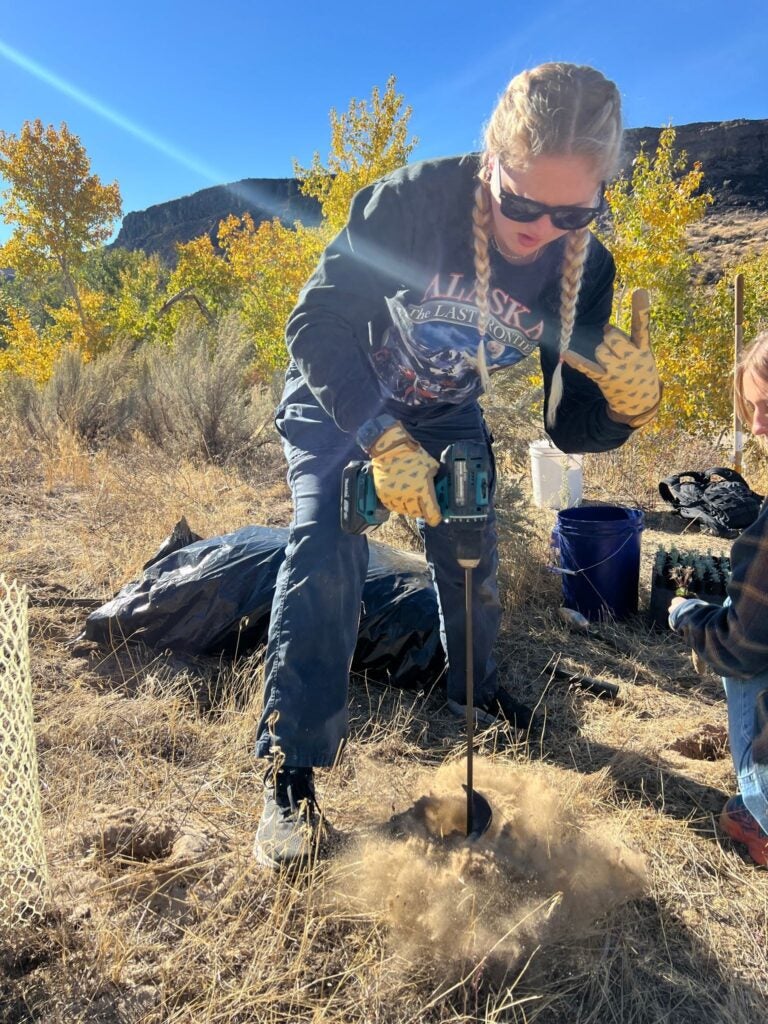 Student digs in the dirt.