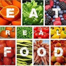 The words Eat Real Food over photos of different fruits and vegetables