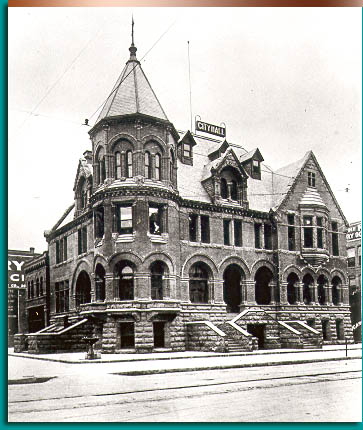 In 1893, at the southeast corner of 8th and Idaho, Boise opened its new city hall. Mayor Pinney commissioned Montana archicture James C. Paulsen to design the building as a red-brick castle in the exotic Rhenish Revival Style. Idaho State Historical Society.