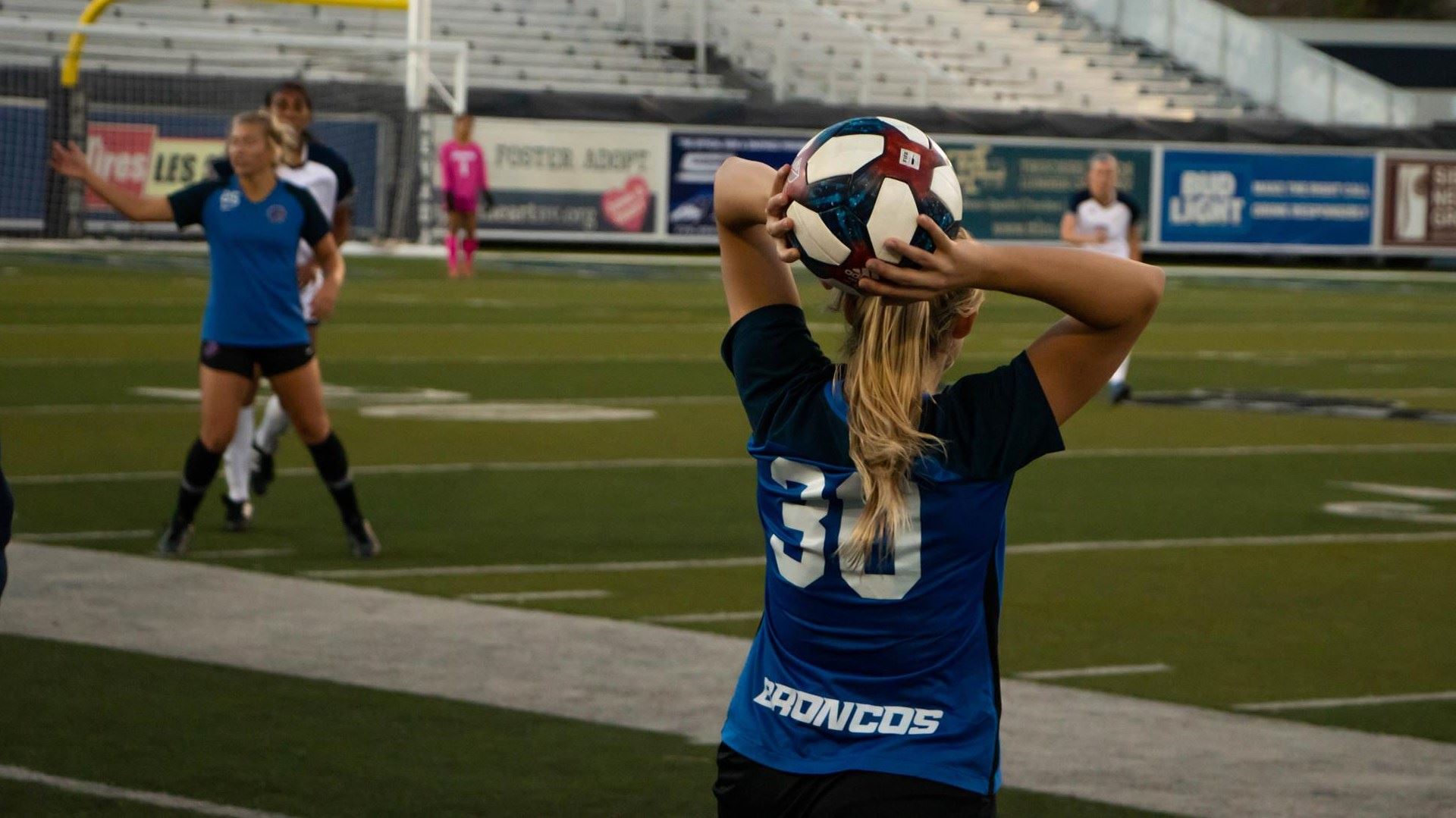 player throwing a soccer ball onto the field