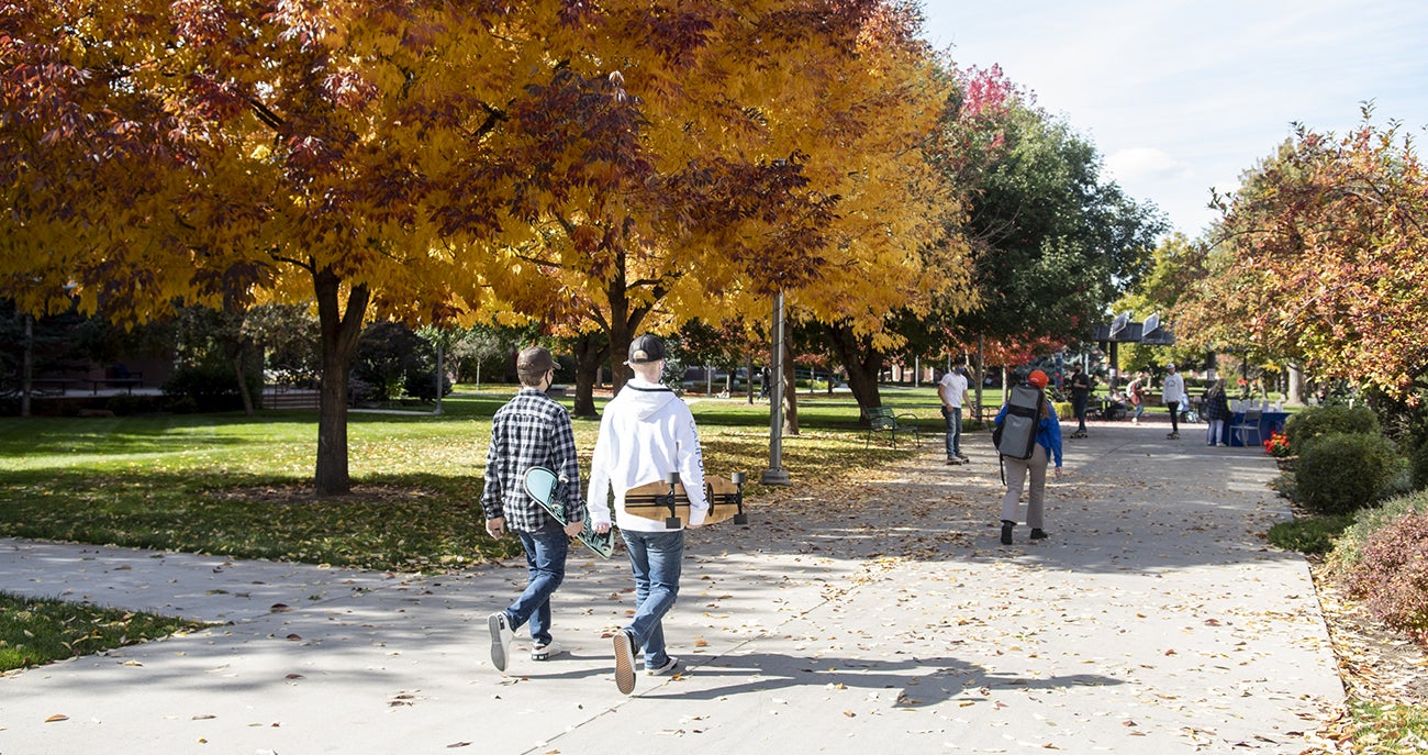 Students walking through the Quad near Albertsons Library during autumn
