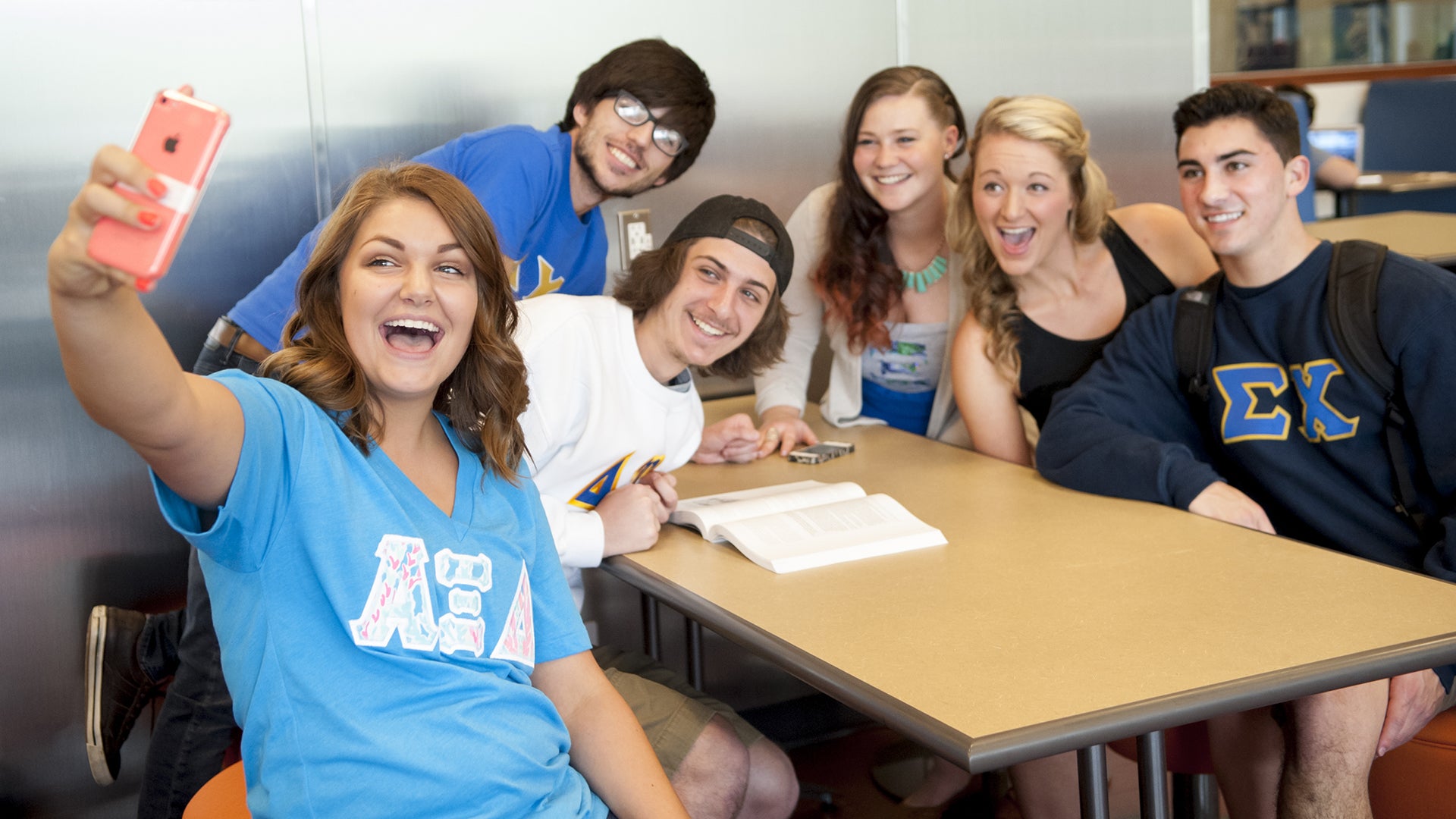 Students from different fraternities and sororities in the Interactive Learning Center