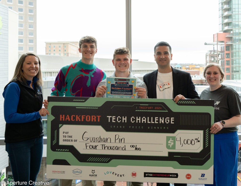 Hackfort Tech Challenge Winne Jake Stubber with Check and Boise Entrepreneur Week Golden Ticket pictured with Venture College and Trailhead Staff