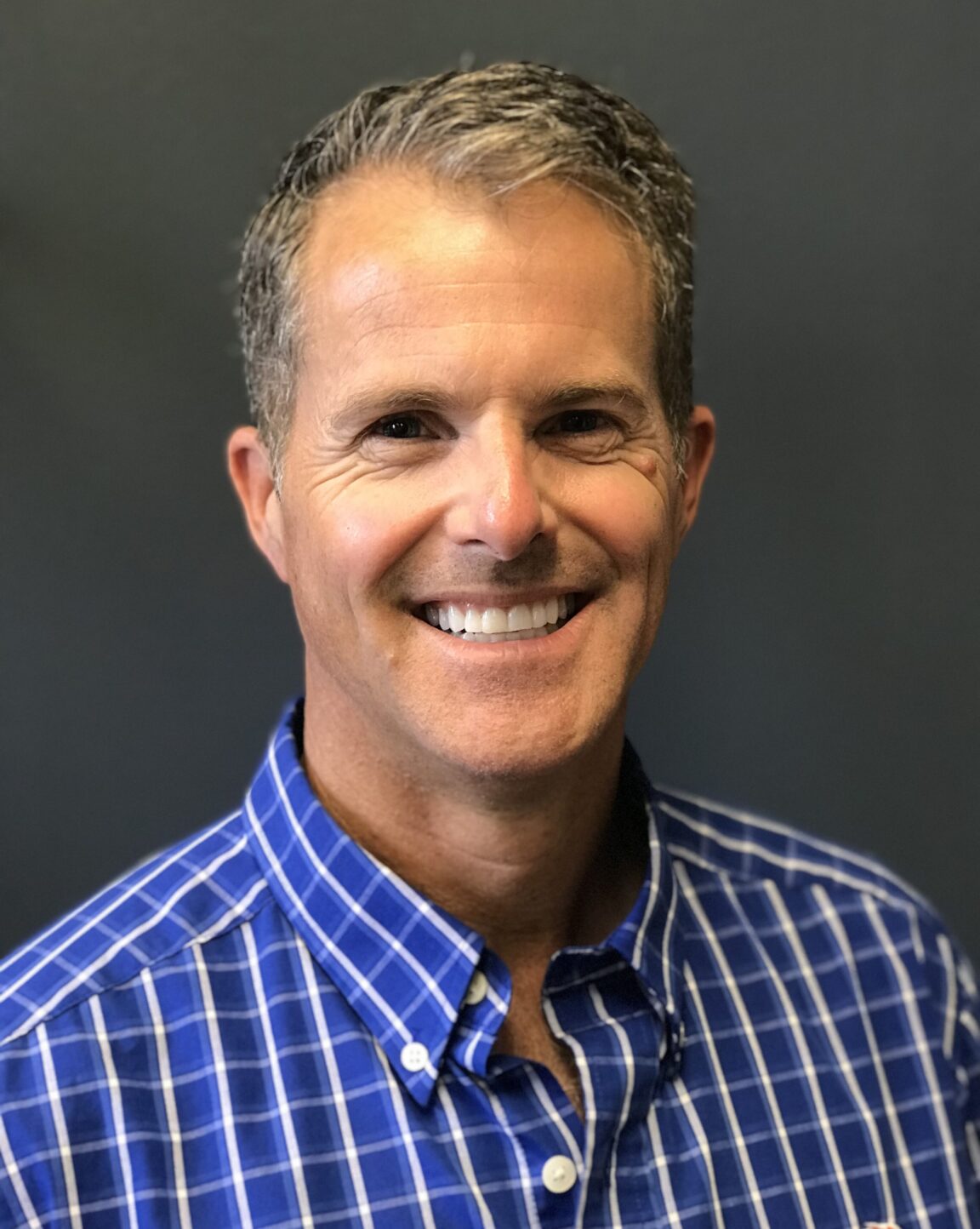 Headshot of Roger Munger. White Male smiling.